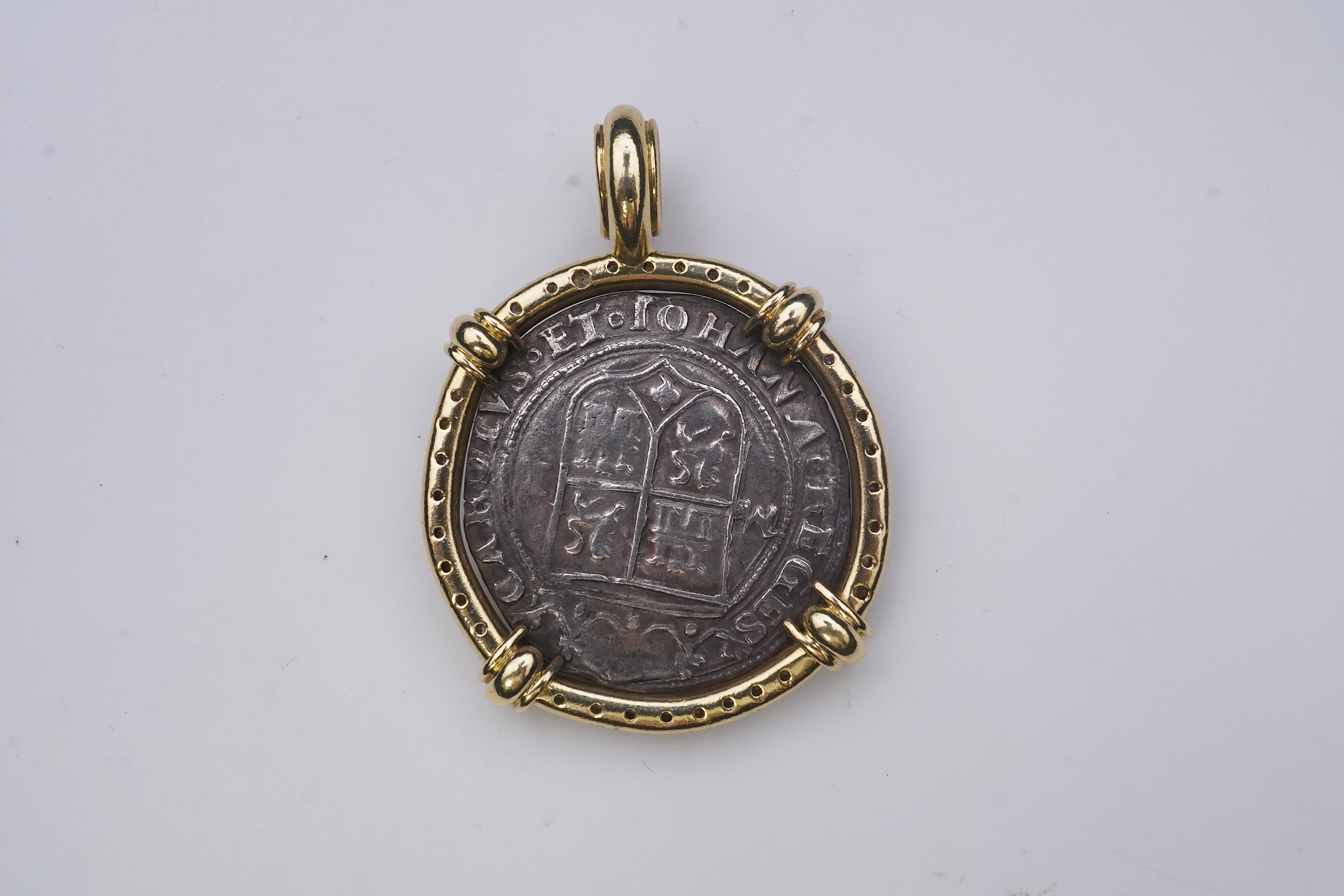 An unusual diamond and 16th century Mexican coin pendant